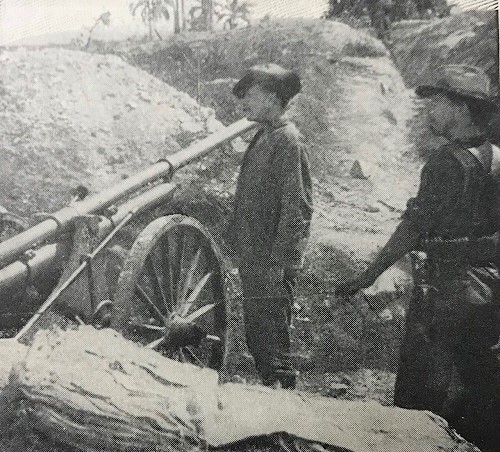 Sgt. Hallet Borrowe with a Dynamite Gun